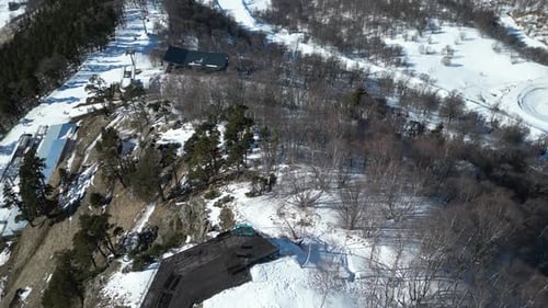 Aerial video above an easy ski slope in Bakuriani, a winter resort in Georgia