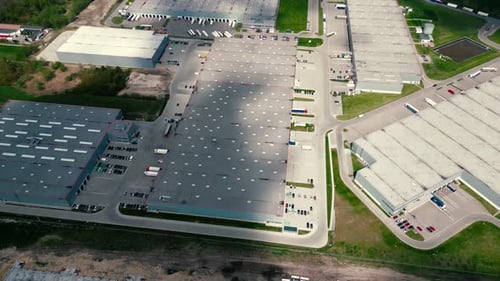 Aerial view of goods warehouse. Logistics center in industrial city zone from above. Aerial view of