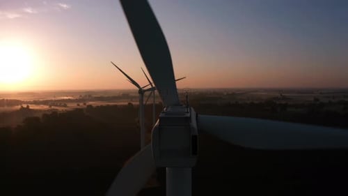 Eco Farm Wind Turbines at Sunrise Aerial View Closeup