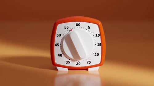 Mechanical kitchen timer ticking down for precise cooking success