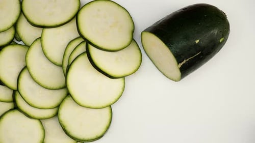 Fresh Sliced Zucchini on a White Surface