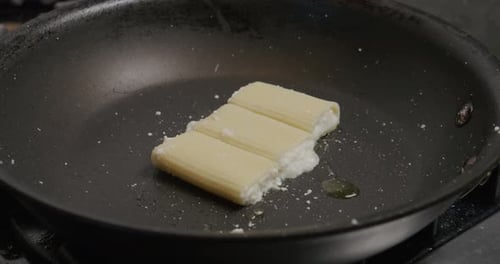 Pasta with Cheese Cooking in a Frying Pan