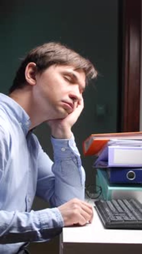 Vertical Video Closeup Tired Office Employee Falling Asleep at Work on Computer