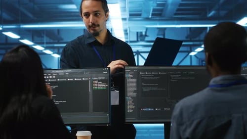Tech Team Collaborating on Coding in Futuristic Office