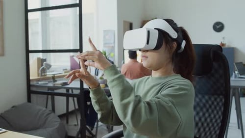 Female IT Engineer Testing Mobile App in Augmented Reality Helmet