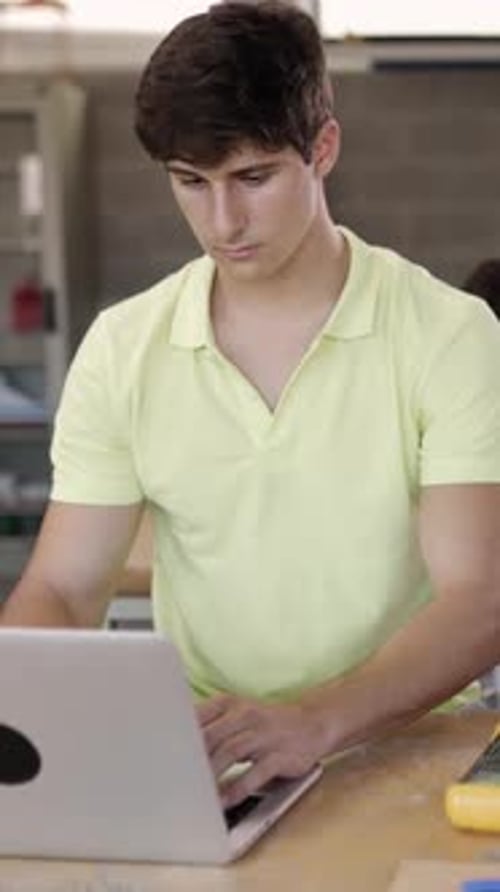 Multiracial Group of High School Students Programming Electronic Circuits