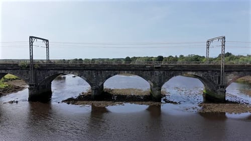 Fast Commuter Train in the UK Passing Over a Bridge