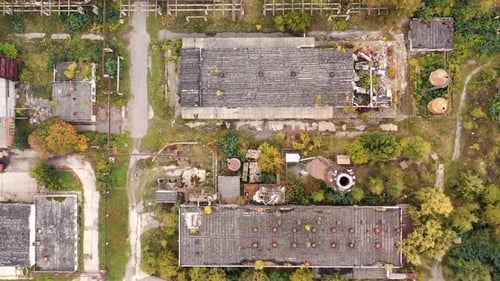 Abandoned destroyed factory territory. Old ruined empty industrial architecture.