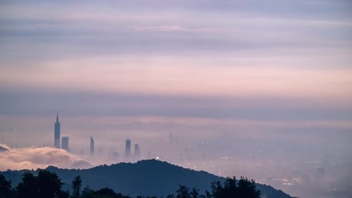 Misty Metropolis: A City Silhouette Veiled in Fog.