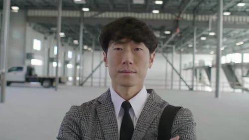 Confident Property Owner Portrait in Warehouse