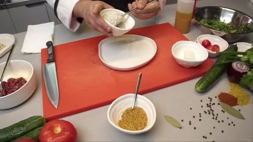 Chef Spreads a Creamy White Sauce Made with Sour Cream and Mayonnaise Flavored with Herbs Onto a