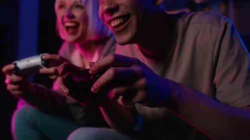 Happy Young Adults Playing Video Games Together