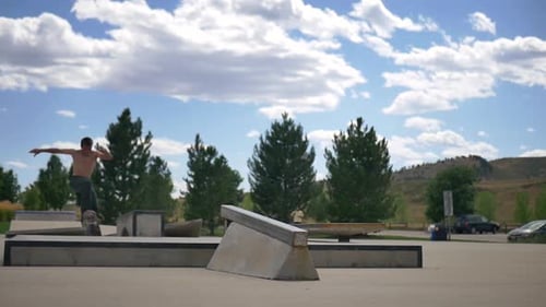 skater does a 180 onto a ledge and then grinds down the rail