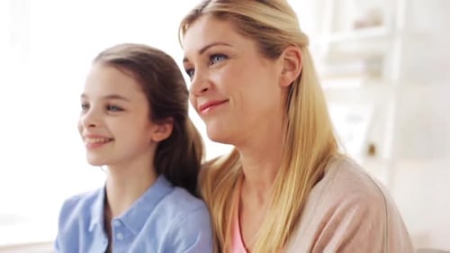Smiling Mother and Daughter Portrait in Bright Home