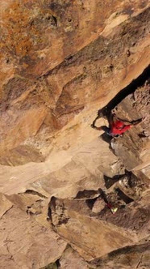 Man Climber Rock Climbing Crack Trad Climbing Aerial View Vertical Video