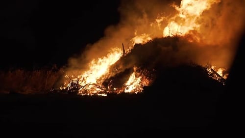 tight shot of massive bonfire burning in slow motion