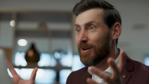 Euphoric businessman expressing joy gesturing at modern office building after victory
