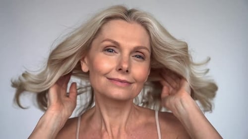 Attractive Woman Massaging Her Face for Skincare