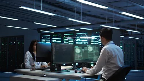 Team of Programmers in Server Hub Trying to Protect Hardware From Hacker