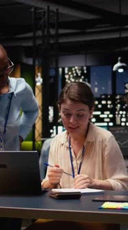 Vertical Video Completing Spreadsheets on Laptop Employee Inputting and Analyzing Data