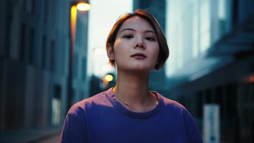 Young Woman Posing in Urban Street at Night