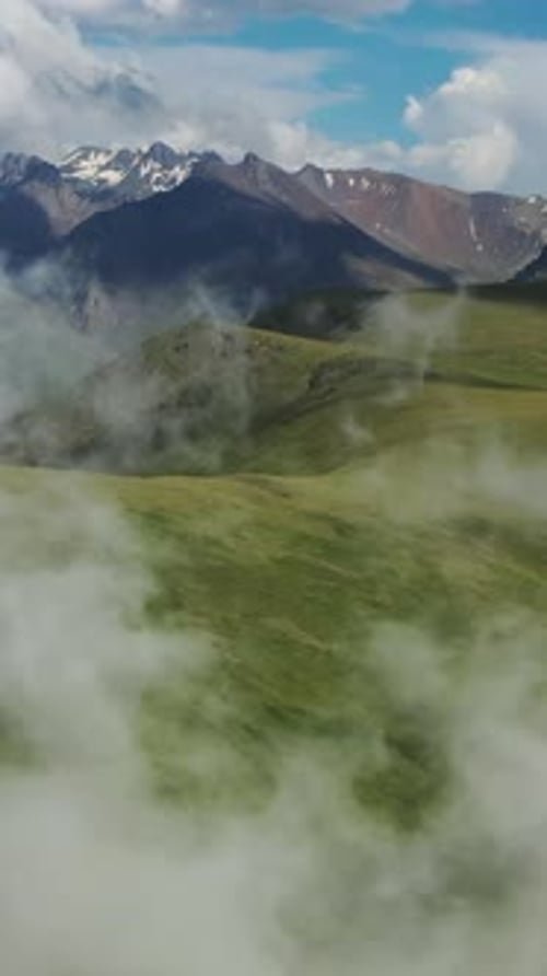 Scenic Mountainous Landscape with Clouds and Fog