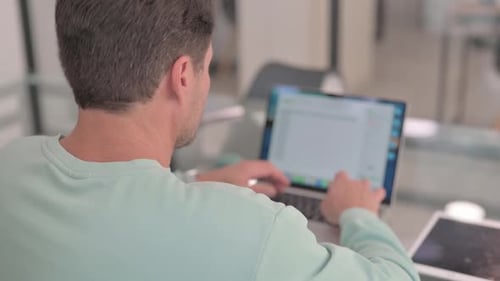 Close up of Man Typing on Laptop