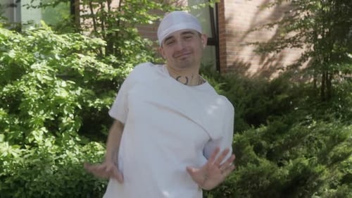 Young Adult Dancing Outdoors in Urban Setting