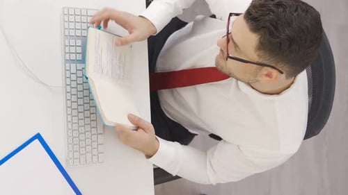 Vertical Video of Businessman working in his office, time lapse.