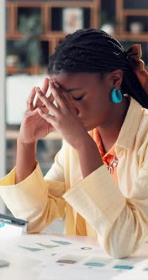 Financial paperwork, laptop and black woman with stress, forecasting mistake