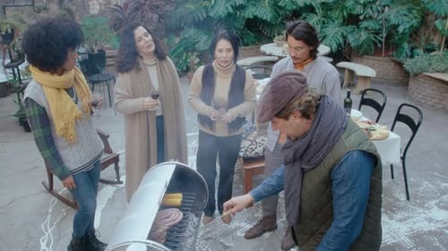Friends Gather for Barbecue in Lush Courtyard