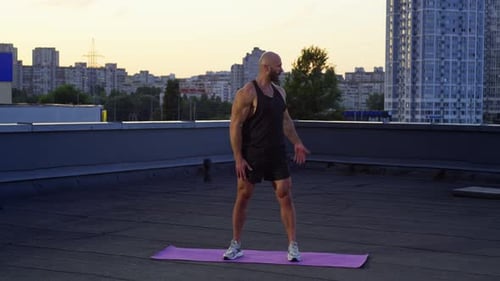 Man Warming Up Before Rooftop Workout