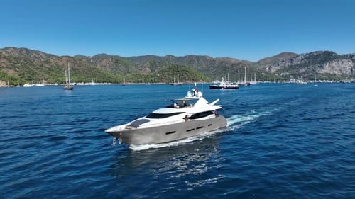 A beautiful and serene scene of a lone yacht on an endless blue sea.