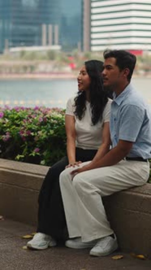 Young Asian Couple Enjoying a Date in a City Park