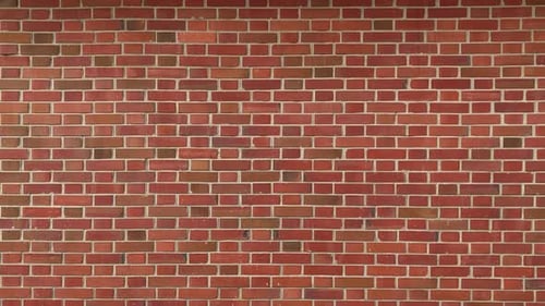 reddish brick wall, move from left to right, dolly zoom