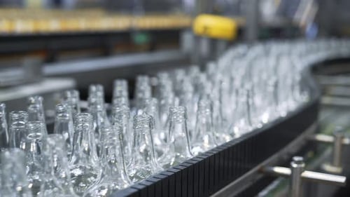 Lot of Bottles Are Carried by Auto Conveyer. Automatic Mill Complex For
