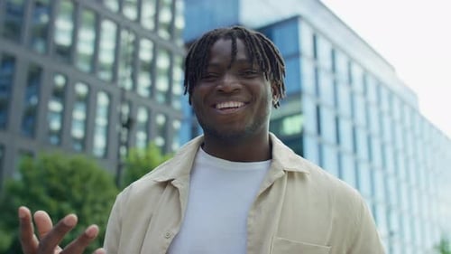 Smiling Man Speaking on Video Call in City POV