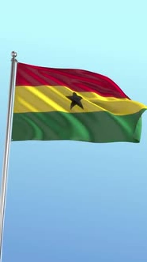 Waving Ghana Flag Against a Clear Blue Sky