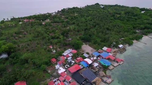 Shanty remote coastal village powered by solar panel in Caribbean island. Aerial