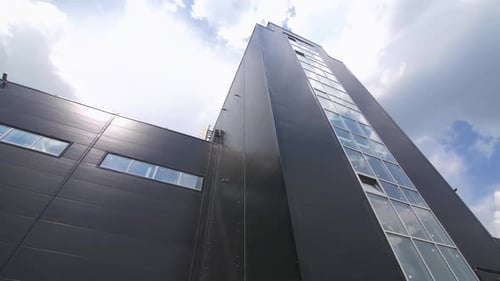 Black Facade with Windows of Large Plant Workshop Closeup