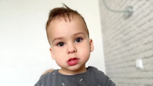 Close Up of Young Child Looking at Camera