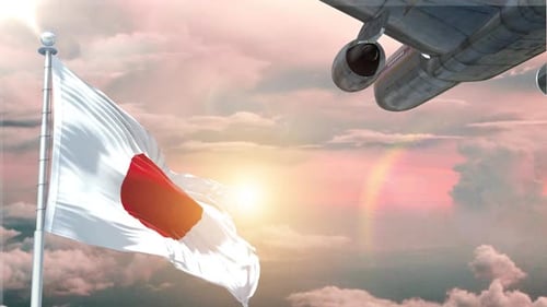 Japanese Flag Waving with Airplane Flying in Golden Sky