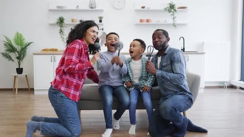 Joyful Family Singing Together at Home