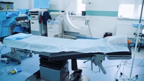Empty Operating Room With Surgical Table and Lights
