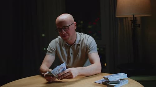 Close Up Man Trader or Businessman Counts Salary Usd Banknotes at Home with His Hands Male