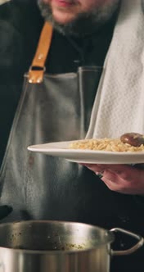 Man, hands and chef with plate of food in kitchen for cooking meal, hospitality or catering service