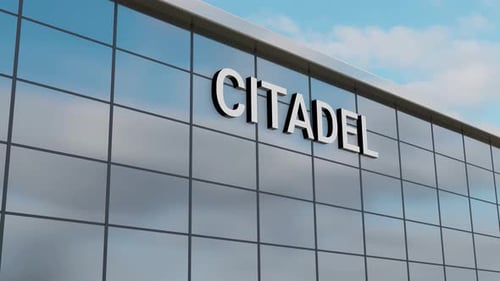 Airplane Passing Over a Citadel Building