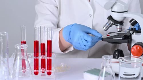 Blood Sample Analyzed Under Microscope in Laboratory