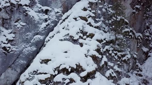 Snow Covered Mountain Rocks in a Beautiful and Serene Landscape Awaiting Exploration Stock Clip