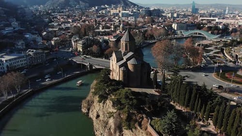 Aerial View of Metekhi Church on Cliff By Kura River in Tbilisi Georgia with Cityscape in the